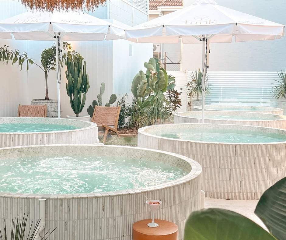 Serene outdoor soaking tubs at TANK Bathhouse, a tranquil oasis perfect for relaxation and rejuvenation at one of the top retreats Sunshine Coast has to offer.