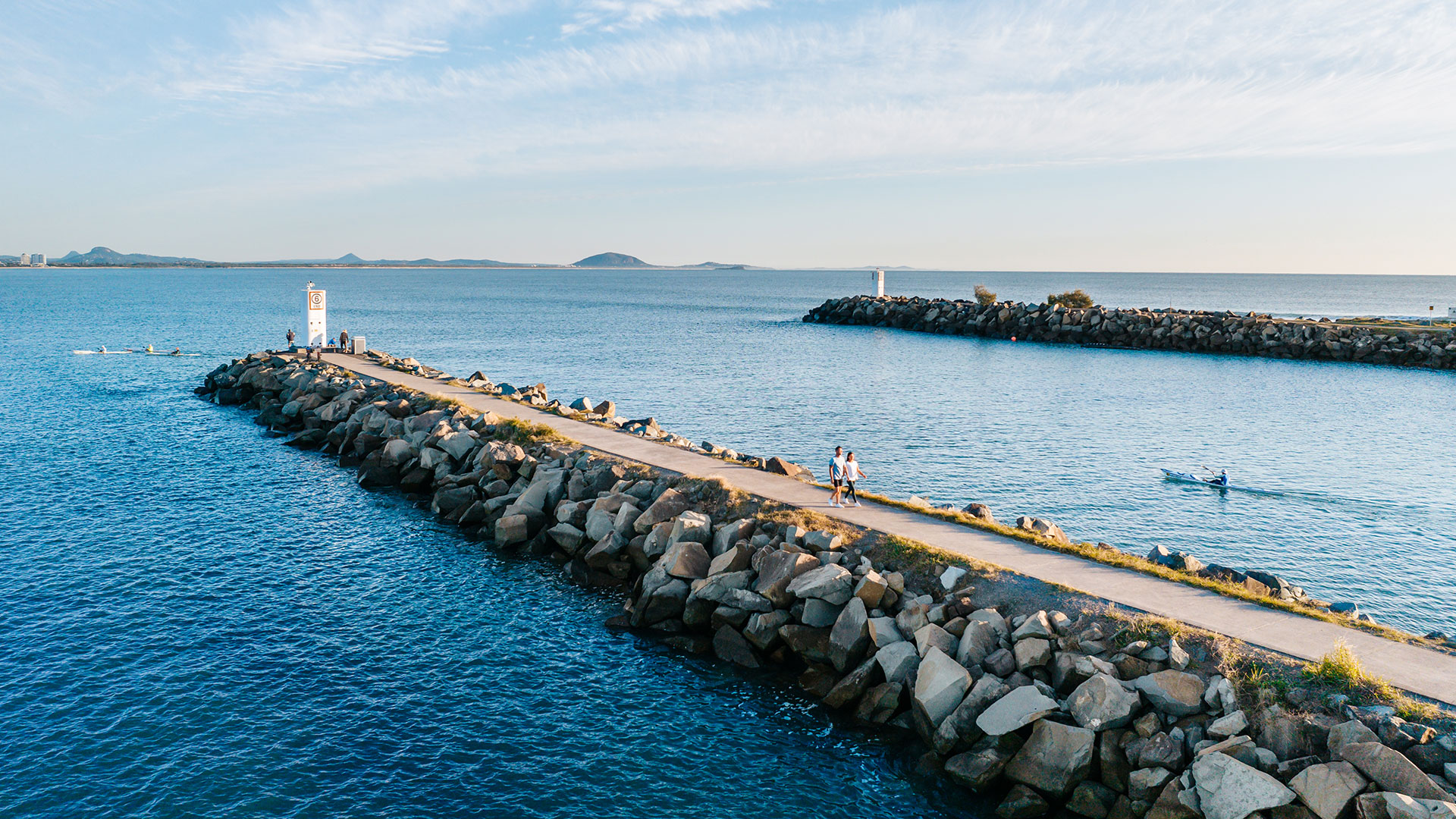 sunrise-mooloolaba-dawn-swims-coffee Sunrise light on the Mooloolaba Spit rock wall and river mouth, an early morning walk near Aegean Mooloolaba